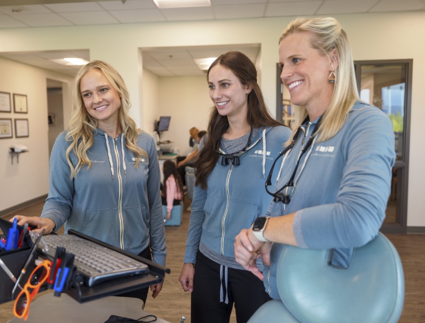 Mother and daughter smiling with straight teeth