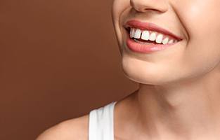 Smiling young woman with gap between her front teeth