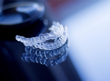 Two clear aligners in Bend, OR on a reflective table