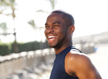 Man outside smiling after clear aligners in Bend, OR