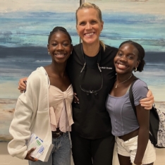 Orthodontic team member holding a giant gift basket