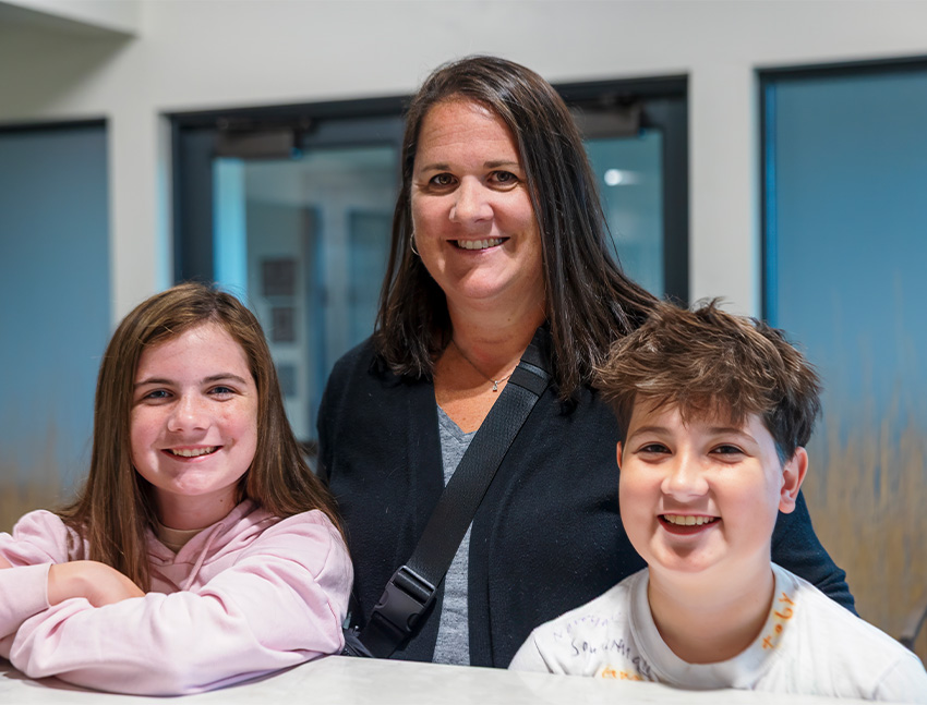 Teenage girl with braces smiling at her soccer game