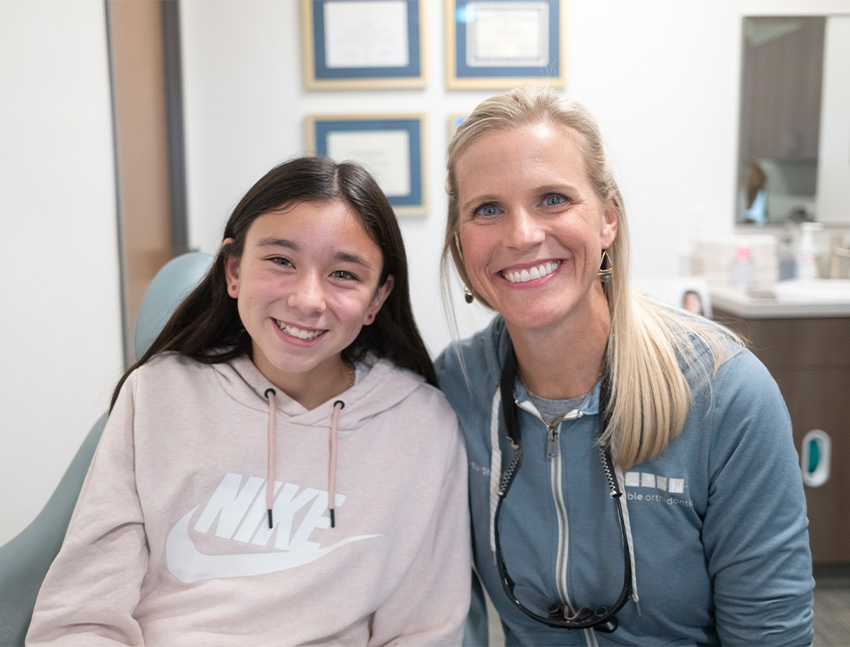 Smiling young man in a green sweater