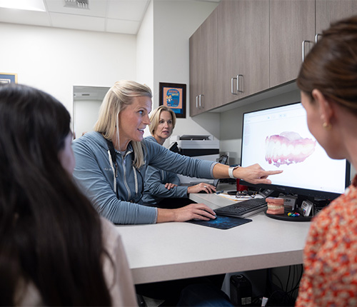 Smiling woman leaning back in the dental chair