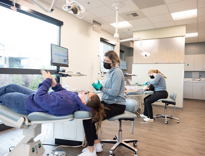 Question mark made of toothpaste between dental instruments