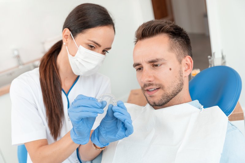 Man at dentist getting clear aligners