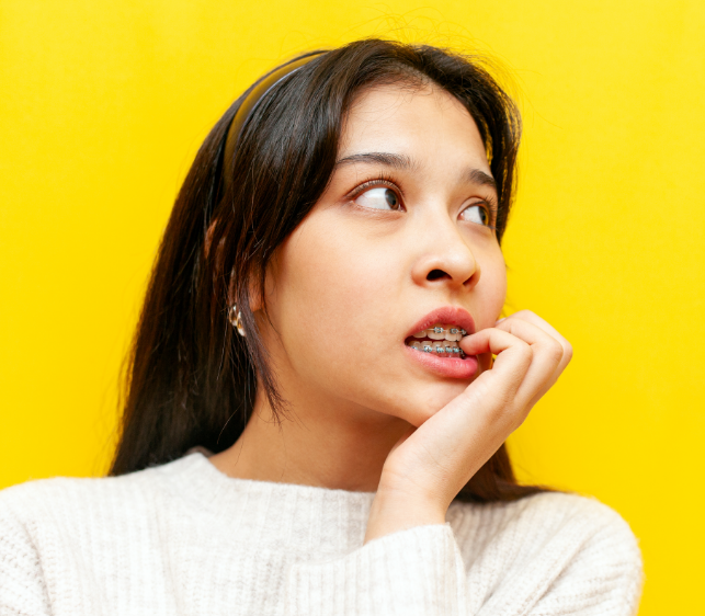 Concerned woman with braces
